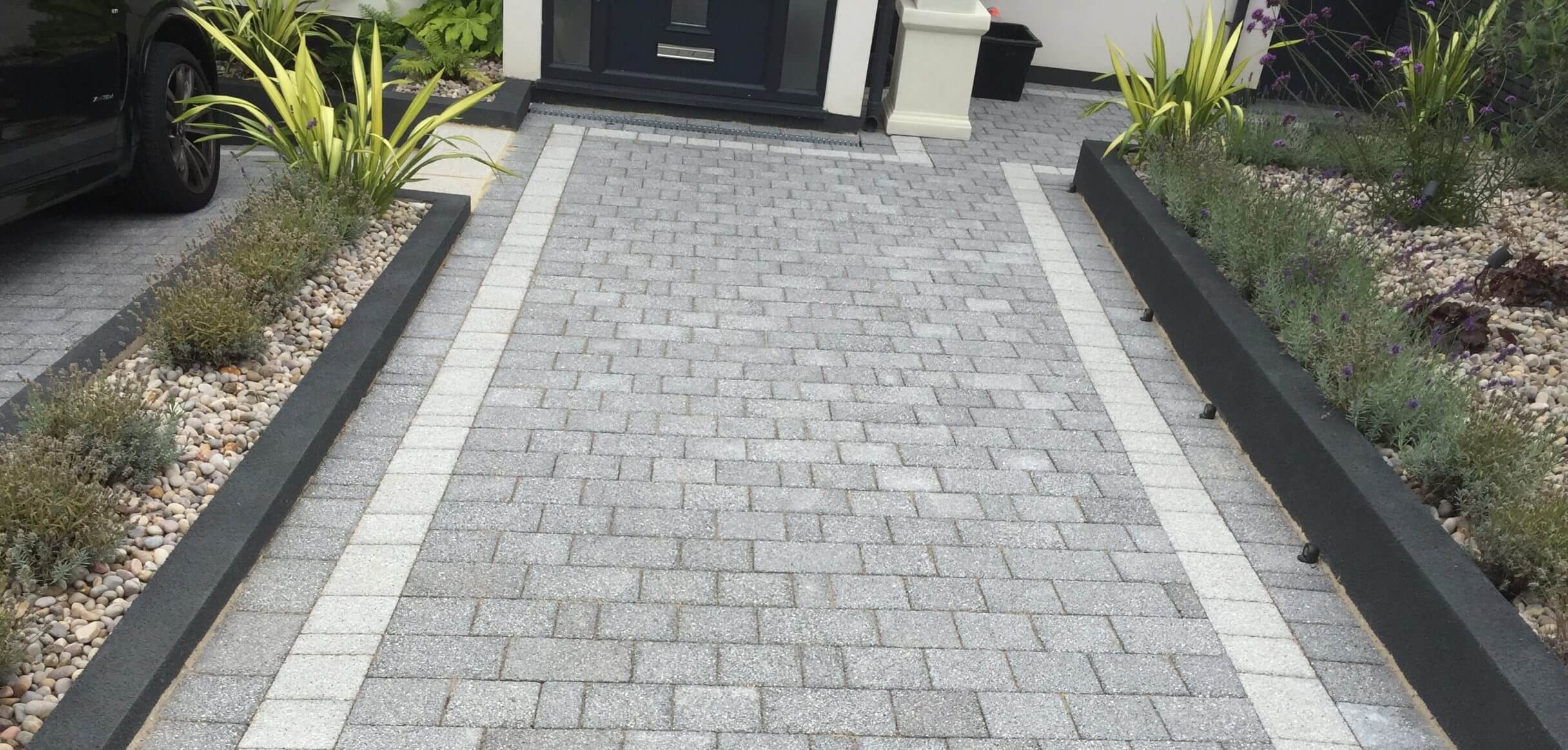new grey pathway in front garden